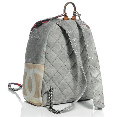 replica chanel graffiti printed canvas backpack|Chanel graffiti printed backpack.